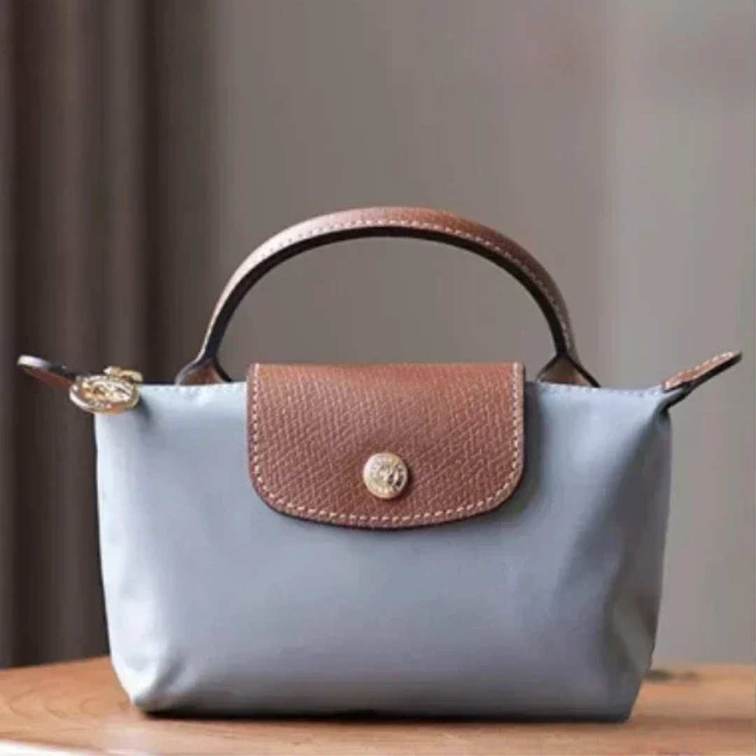 Zolvara - Skórzana Mini Torebka w Stylu Podpisu